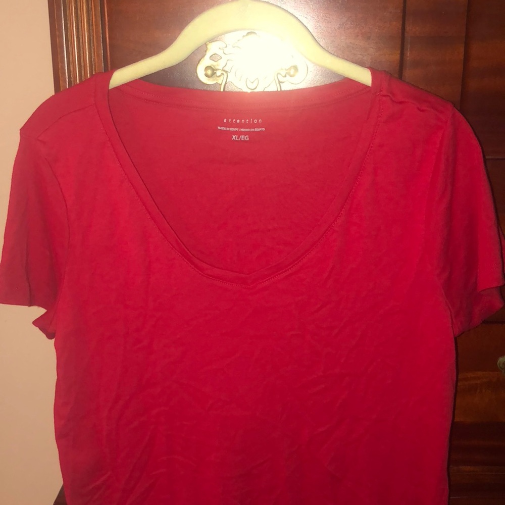 T shirt fits like a large it’s a size Xl/L